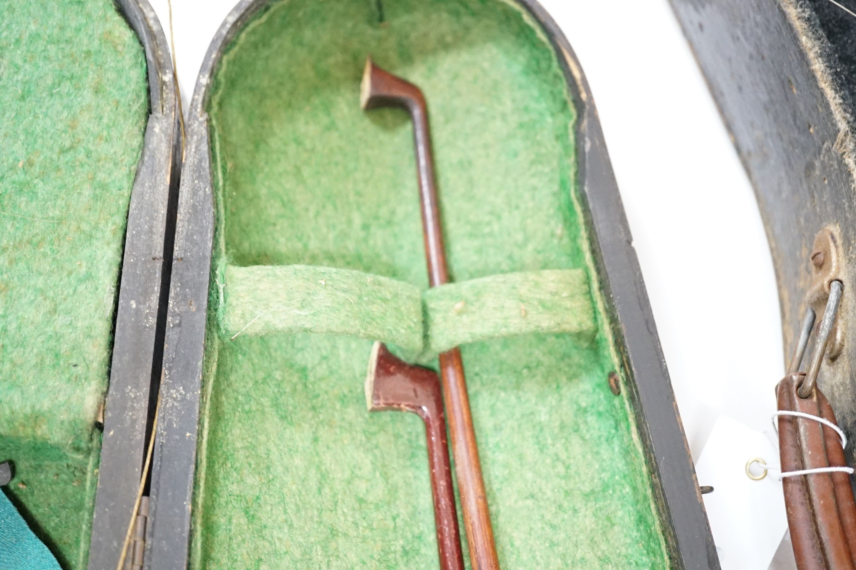 A 19th century 3/4 size violin, cased with 2 bows and 1 other German violin